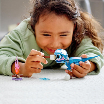 Child playing with LEGO® Disney Frozen 2 Bruni the Salamander toy, enjoying imaginative storytelling and fun details.