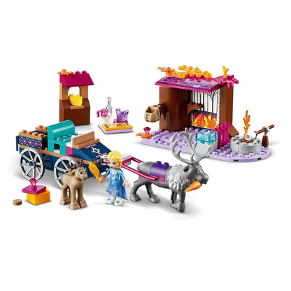 LEGO® Disney Frozen 2 Elsa's Wagon Adventure set featuring Elsa, a horse, and a reindeer with a cozy backdrop.