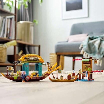 LEGO® Disney Princess Boun’s Boat Toy showing shrimp boat, dock, mini-doll figures Sisu and Boun in a creative play setting.