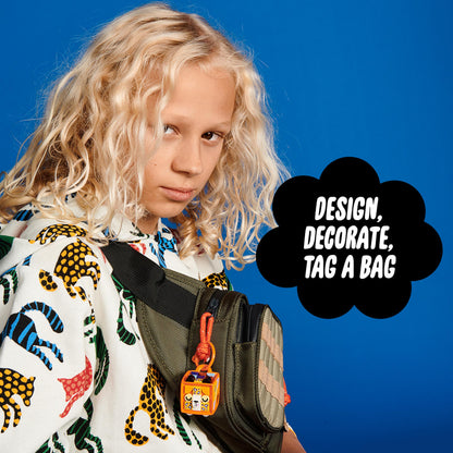 Child showing off a creatively designed LEGO® DOTS Bag Tag Leopard, encouraging artistic expression and personalization.