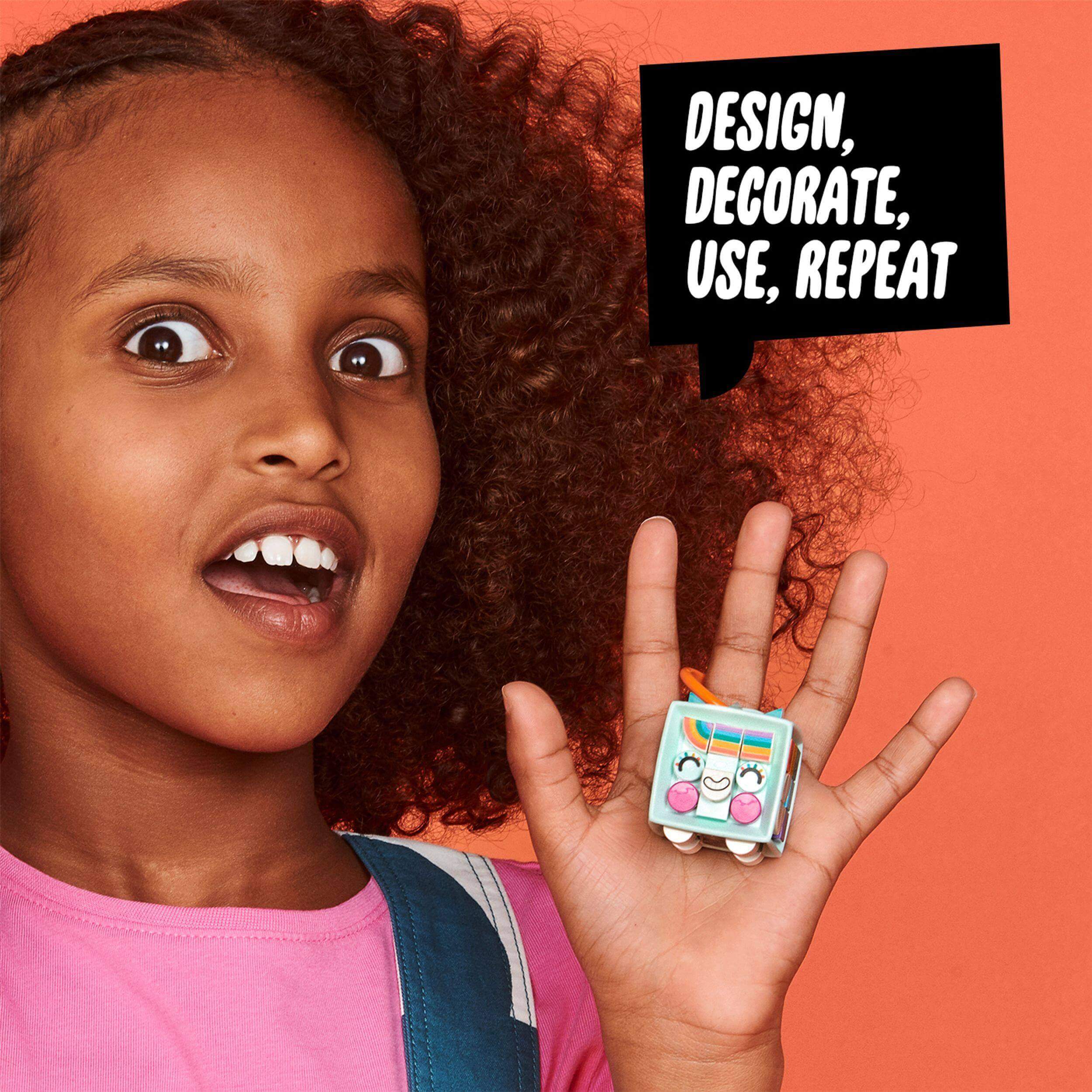 Child excited about the LEGO DOTS Bag Tag Unicorn kit, showcasing creativity with a designable accessory. 41940.