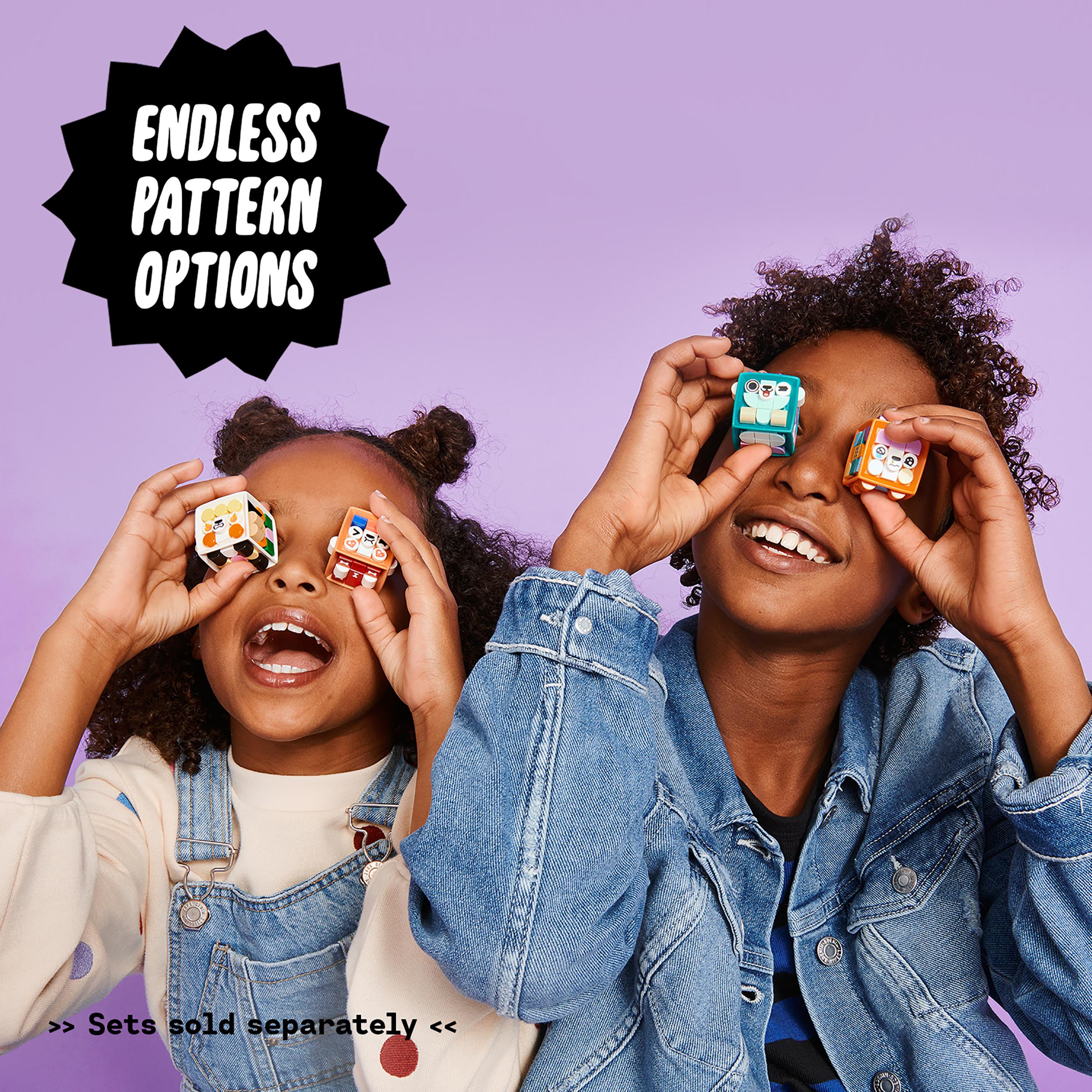 Two children holding LEGO DOTS tiles against a purple background, showcasing endless pattern options for crafting fun.