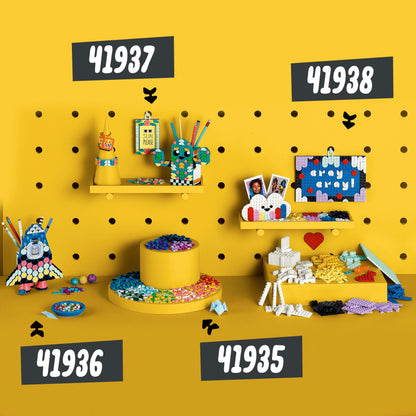 Colorful LEGO® DOTS craft sets 41936, 41937, and 41938 displayed on yellow background, showcasing creative pencil holder and accessories.