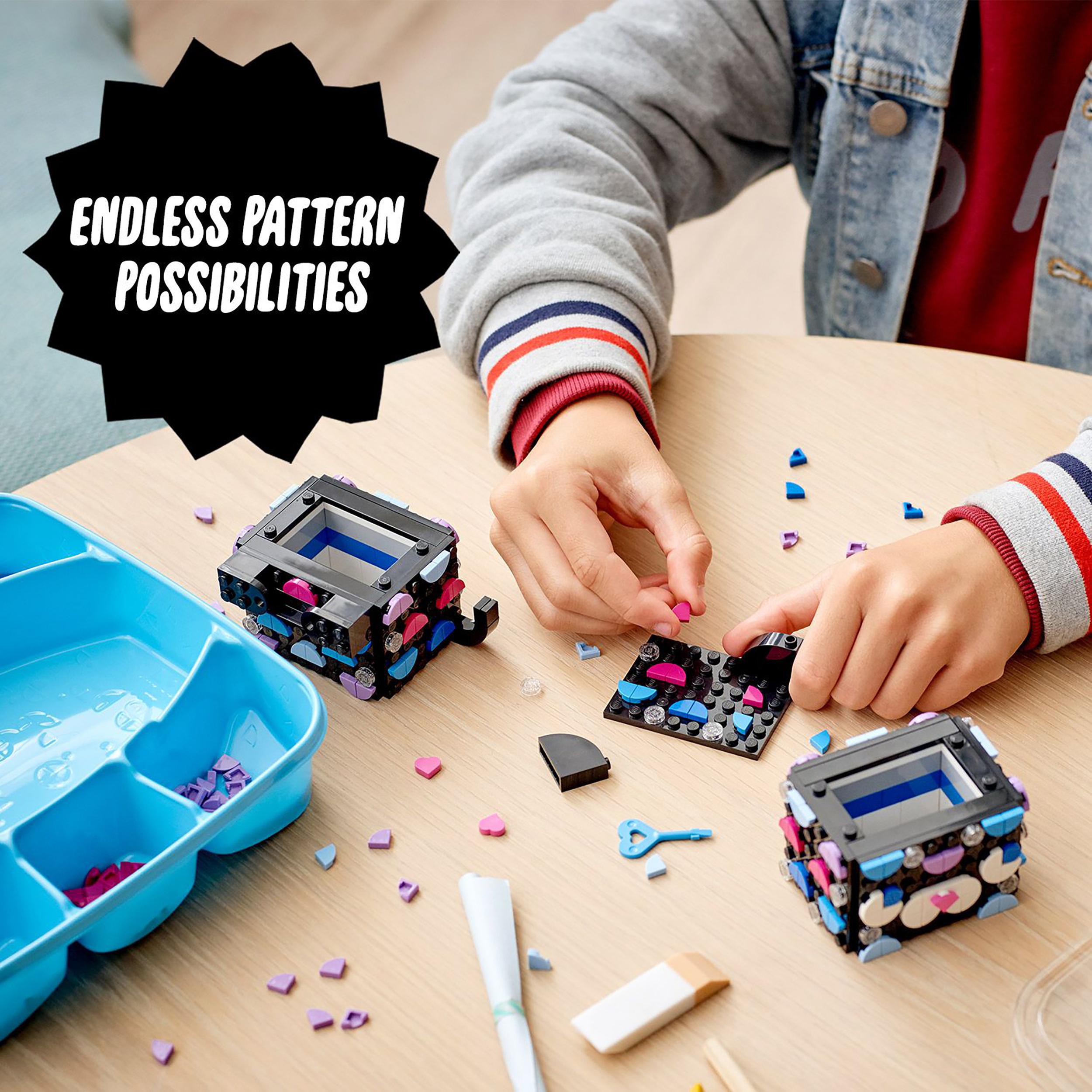 Child creating with LEGO® DOTS Secret Holder set, showcasing endless design possibilities and colorful tiles.