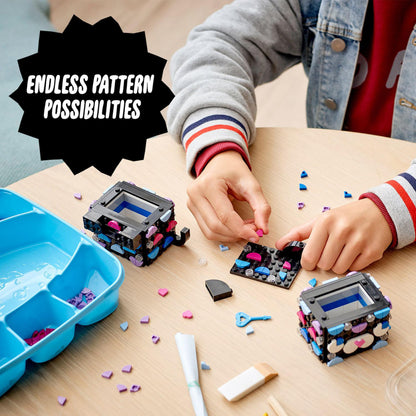Child creating with LEGO® DOTS Secret Holder set, showcasing endless design possibilities and colorful tiles.