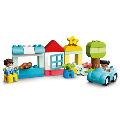 Colorful LEGO® DUPLO Classic Brick Box Set 10913 with kids playing, a house, tree, and car for creative toddler play.