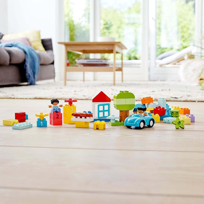 Colorful LEGO® DUPLO Classic Brick Box Set 10913, featuring toddlers playing with building blocks, a car, and a vibrant play area.