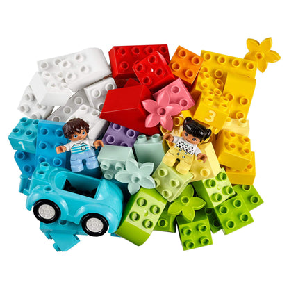 Colorful LEGO® DUPLO bricks and two figures with a blue car, perfect for creative play and toddler development.