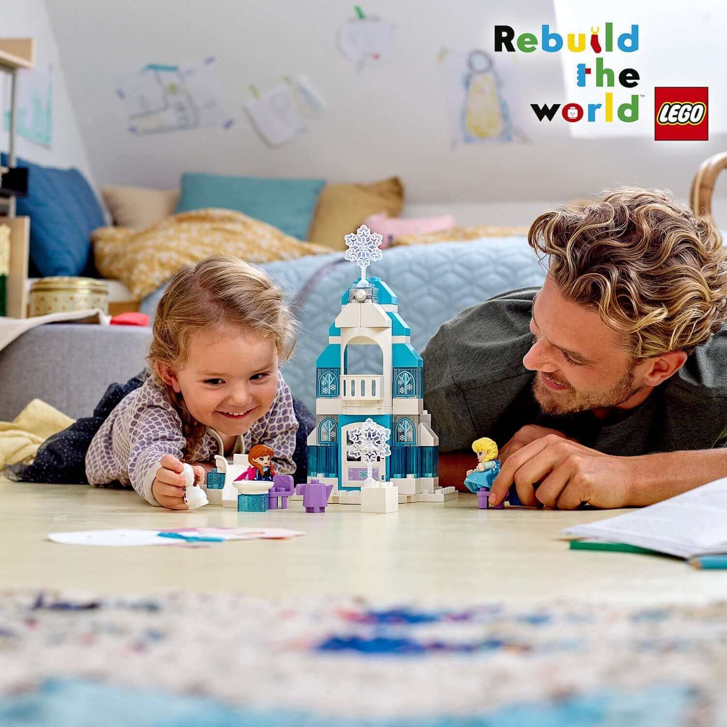 Father and daughter playing with LEGO® DUPLO Disney Frozen Ice Castle Set 10899, enjoying imaginative storytelling.
