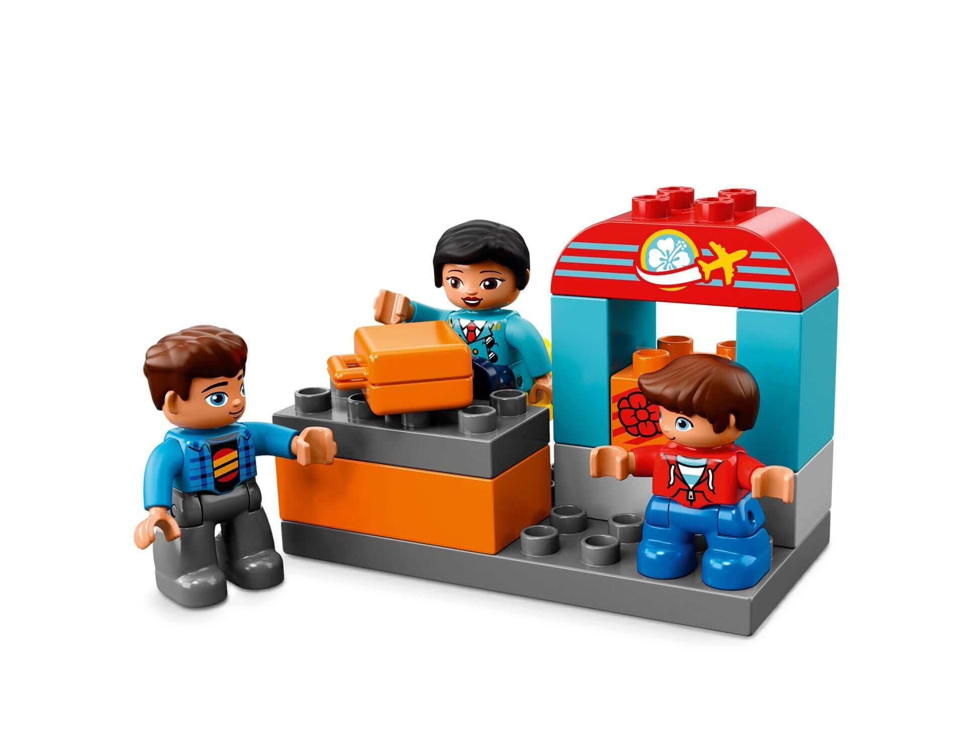 Children playing with LEGO® DUPLO My Town Airport set, featuring an airport check-in area and colorful mini figures.