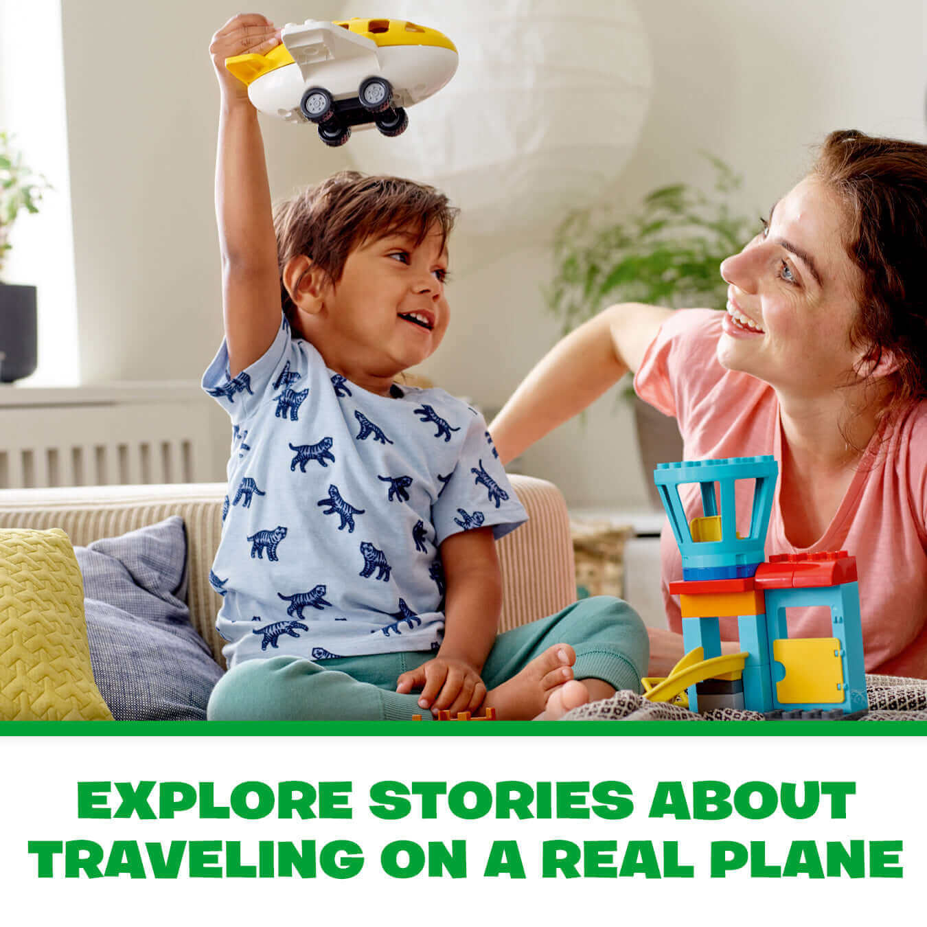 Child playing with LEGO DUPLO airplane while adult smiles, showcasing imaginative airport fun.