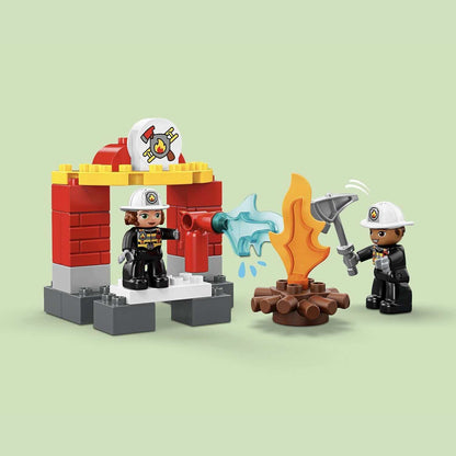 LEGO DUPLO Town Fire Station set featuring two firefighters, a fire engine, and flames for imaginative play.