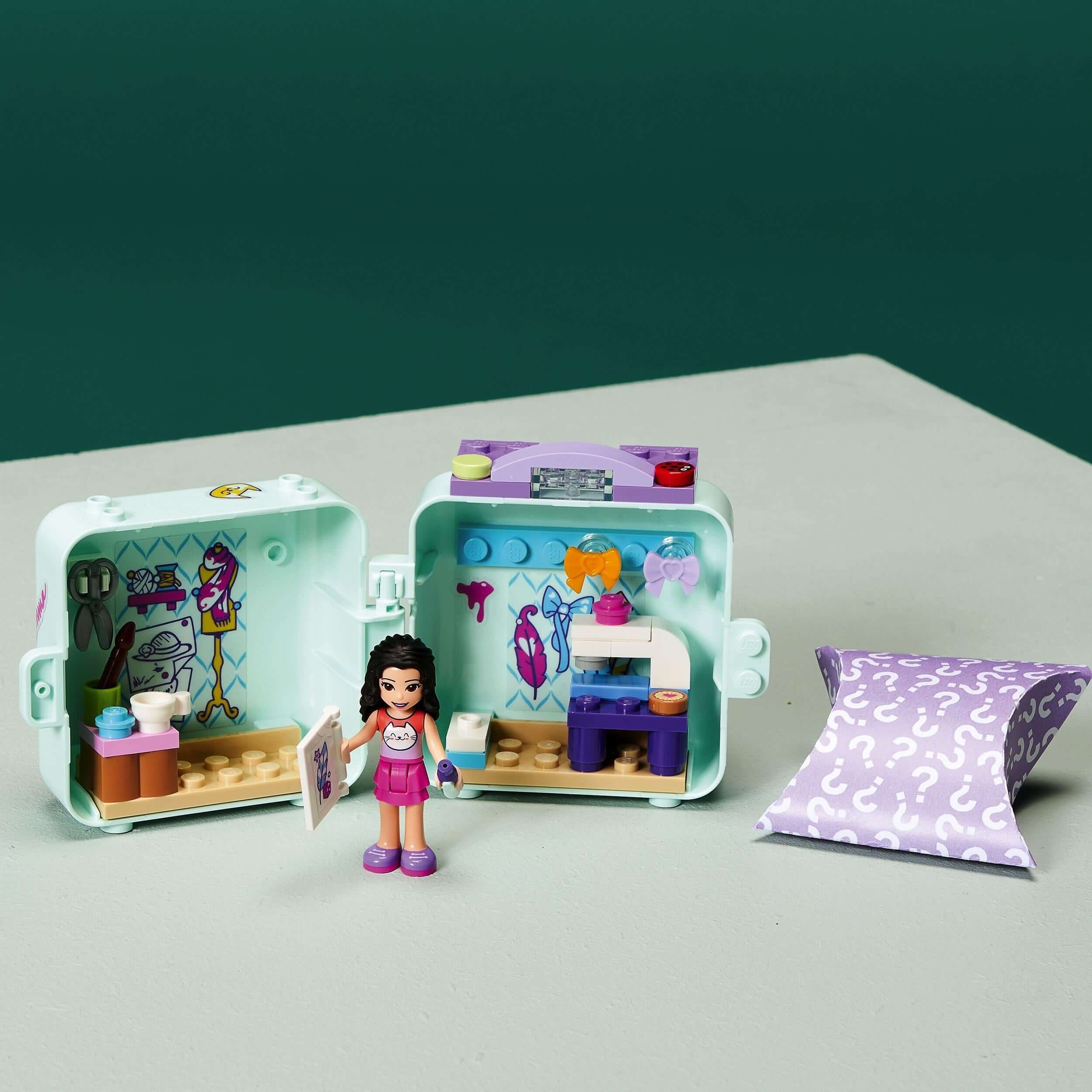 LEGO® Friends Emma’s Fashion Cube Play Set 41668 with mini doll and sewing accessories for creative play.