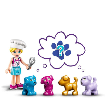 LEGO® Friends Stephanie with baking tools and colorful puppy figures in her playful world.