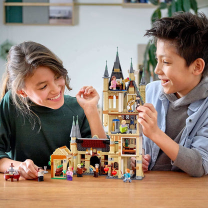 Children playing with LEGO® Harry Potter Hogwarts Astronomy Tower set 75969, showcasing iconic details and vibrant creativity.
