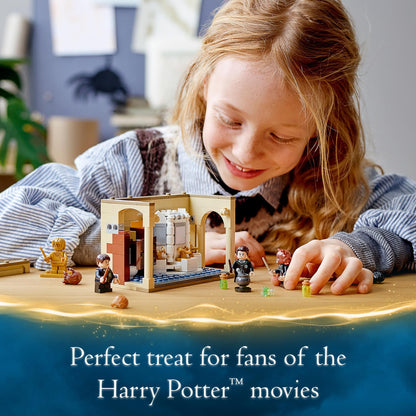 Child playing with LEGO® Harry Potter Potion Mistake set, enjoying magical adventures in Hogwarts bathroom.