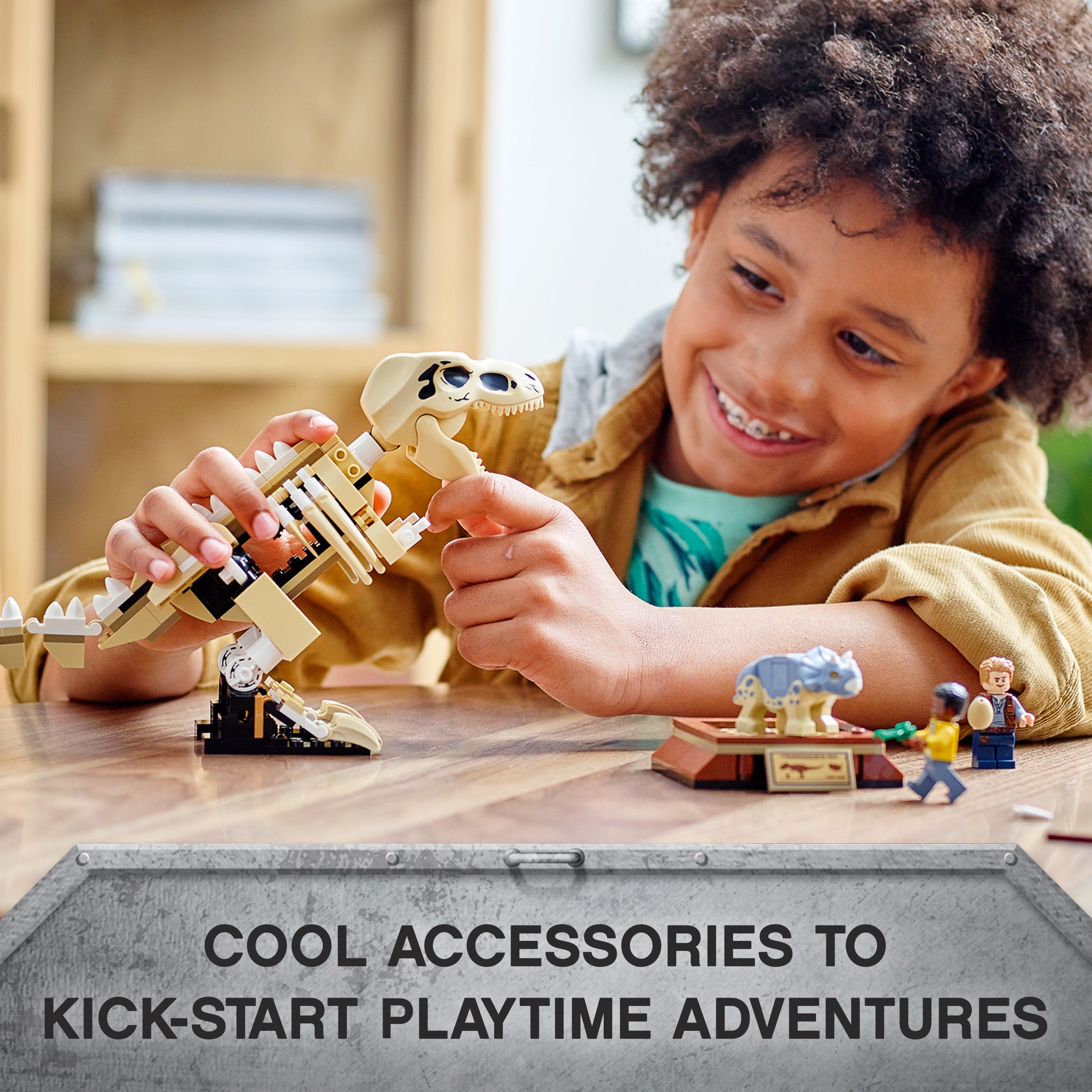 Child engaging with LEGO® Jurassic World T. rex skeleton and Baby Triceratops, showcasing playful learning.