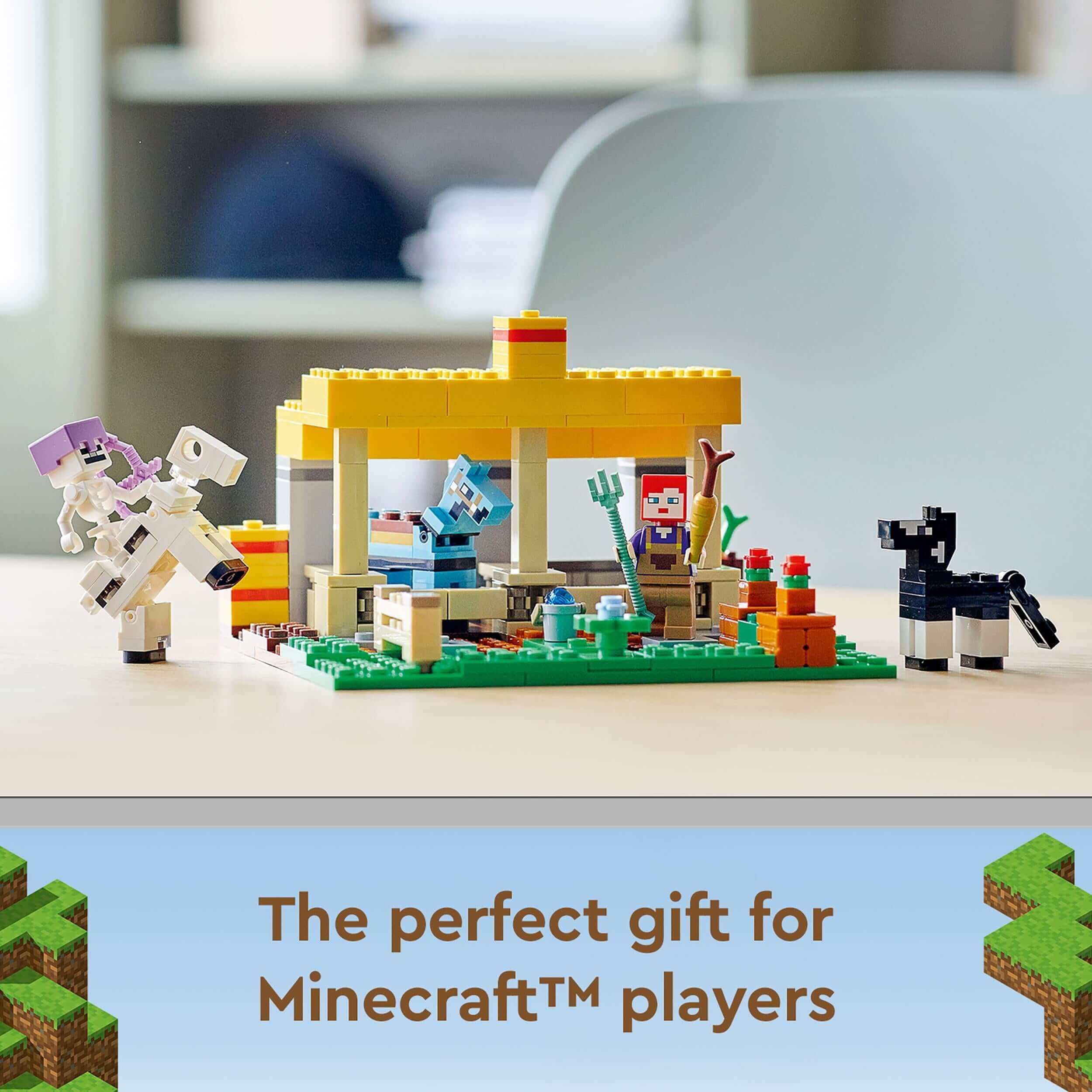 LEGO® Minecraft The Horse Stable toy showing characters caring for horses and building obstacle courses.