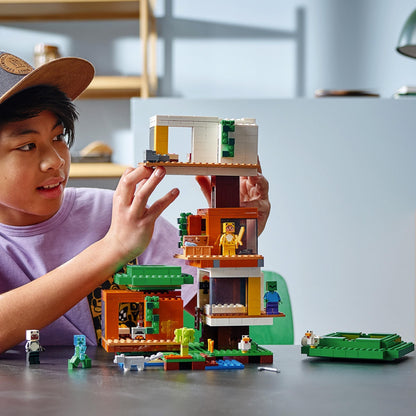Child building LEGO Minecraft Modern Treehouse 21174 with modular rooms and Minecraft characters in a colorful setting.