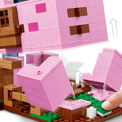 LEGO Minecraft The Pig House Toy showing a buildable pig-shaped house with movable parts and green base.
