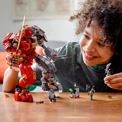 Child playing with LEGO® NINJAGO Fire Stone Ninja Mech Toy 71720 in an epic battle scene.