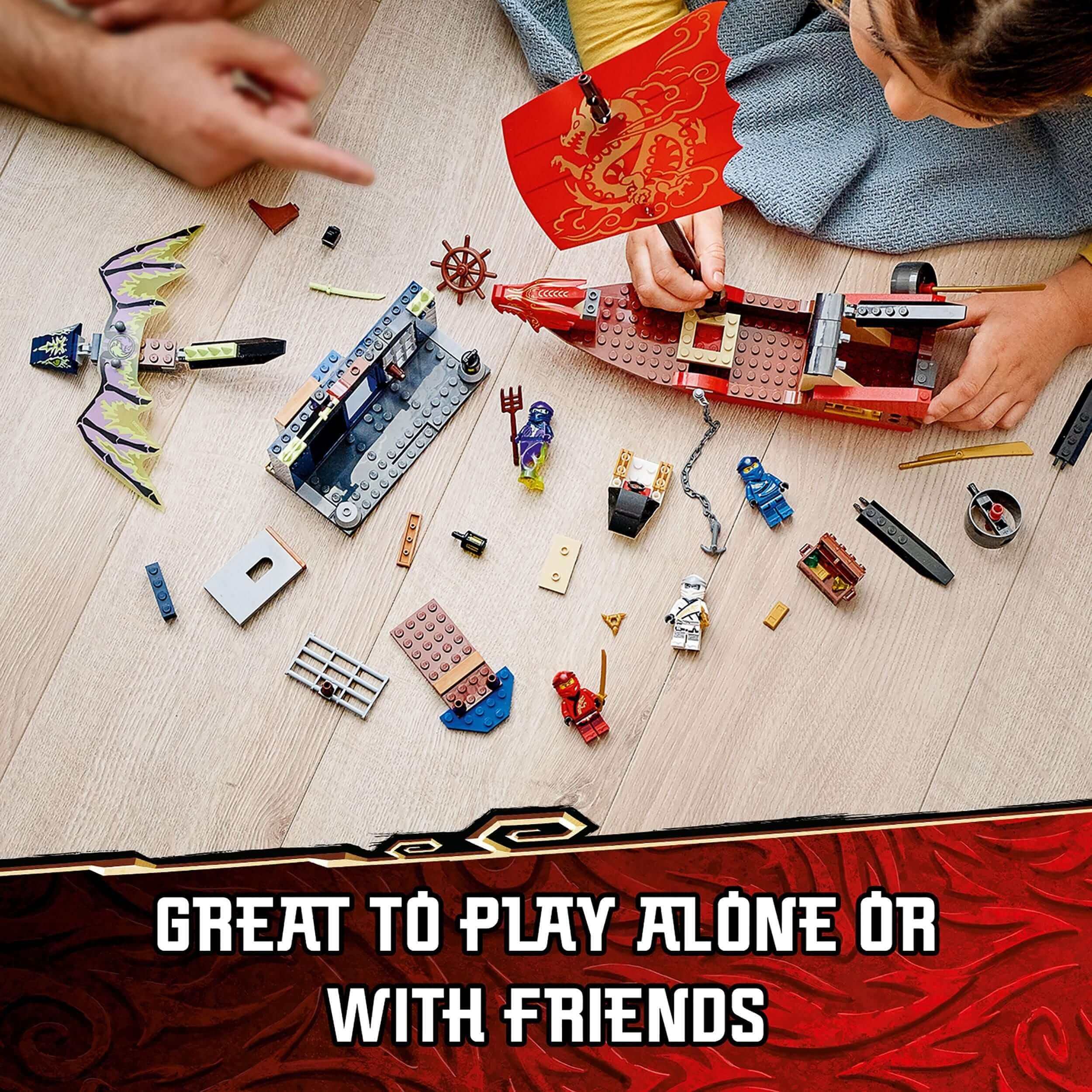 Kids building and playing with LEGO® NINJAGO Legacy Destiny’s Bounty ship set, showcasing creativity and fun.