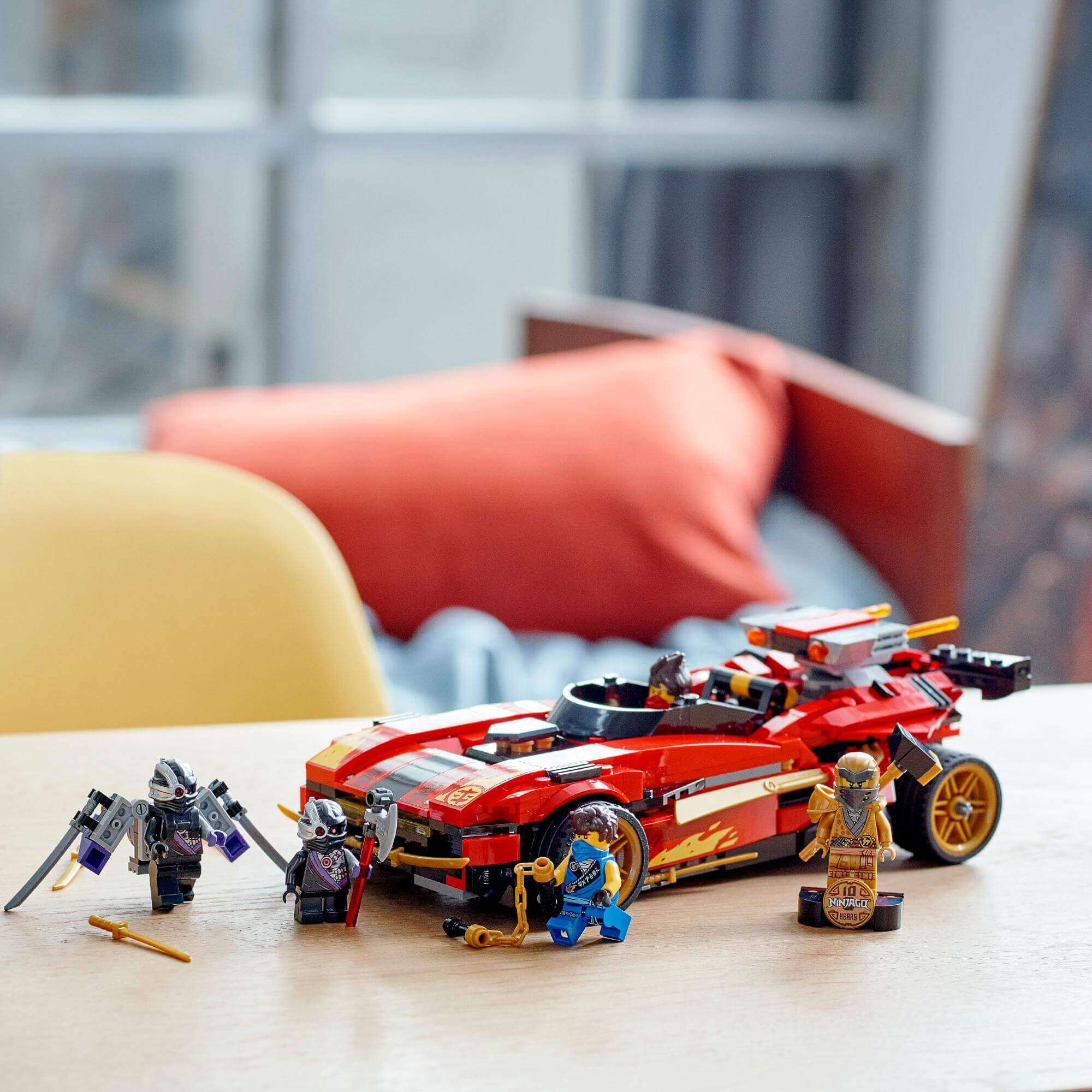 LEGO NINJAGO Legacy X-1 Ninja Charger Set 71737 with ninja minifigures in a play setting on a table.
