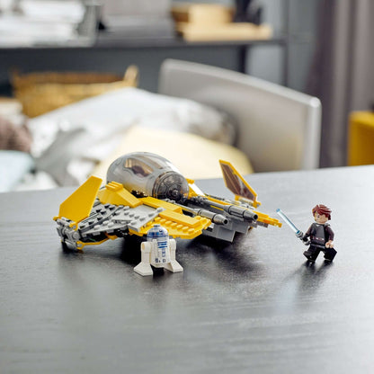 LEGO Star Wars Anakin's Jedi Interceptor set with Anakin Skywalker and R2-D2 figures on a table.