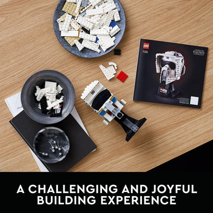 LEGO® Star Wars Scout Trooper Helmet 75305 set with pieces and instruction booklet on a wooden table.