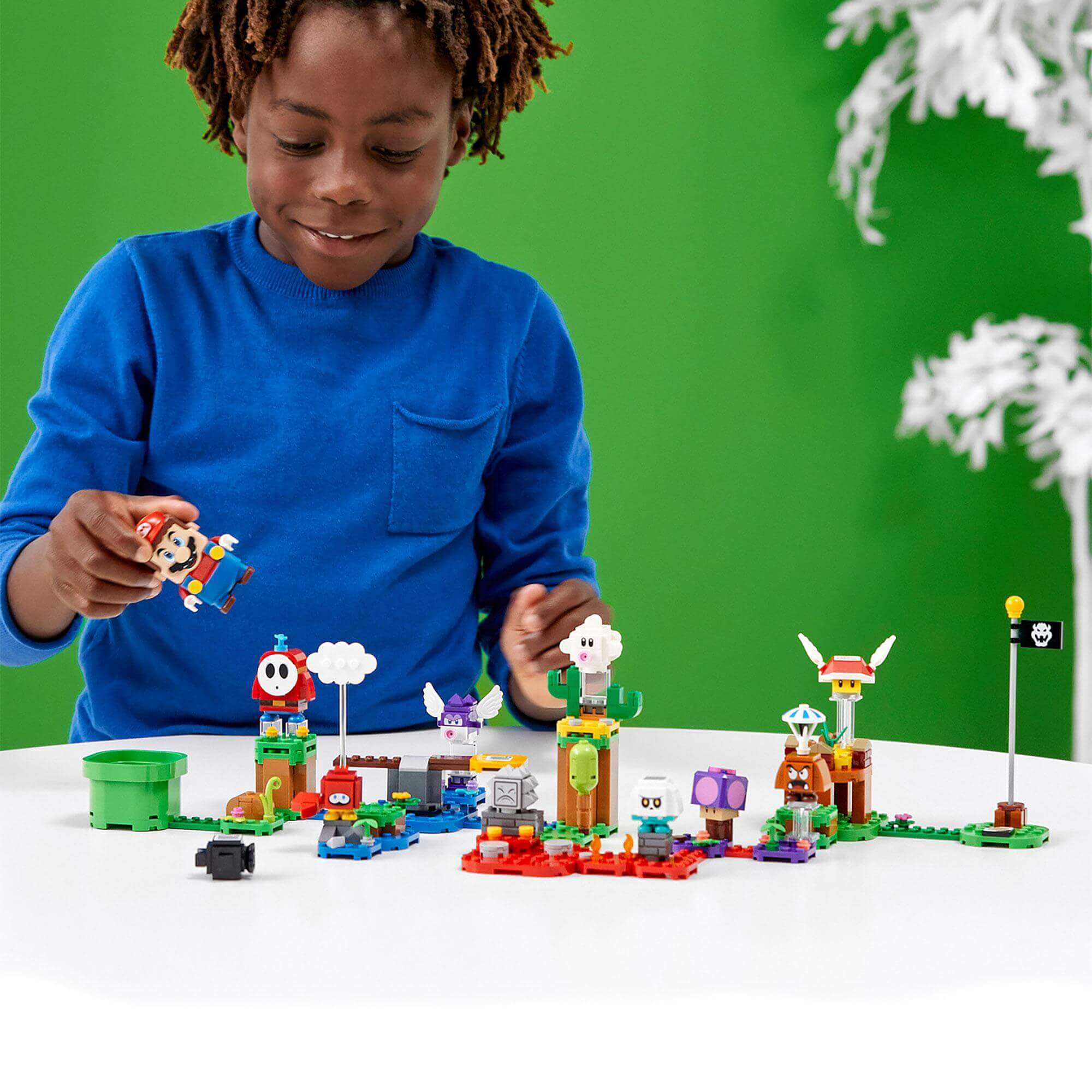 Child playing with LEGO® Super Mario Character Packs Series 2, featuring buildable characters and imaginative play.