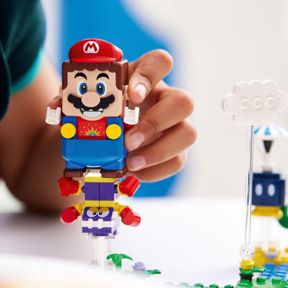 Child holding LEGO® Super Mario character figure, showcasing buildable fun from Series 3 Character Packs.
