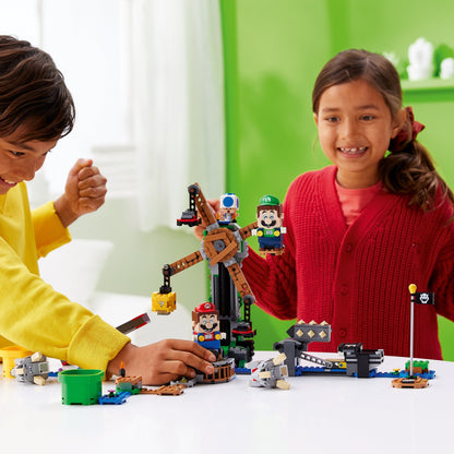 Kids enjoying LEGO® Super Mario Reznor Knockdown Expansion Set 71390, featuring interactive play with Mario and Luigi.