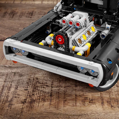 Close-up of LEGO® Technic Dom's Dodge Charger engine, showcasing detailed parts from The Fast and The Furious set 42111.