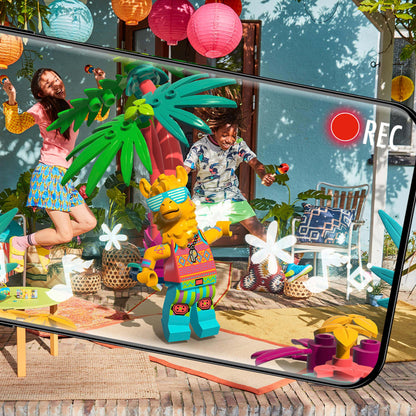 Kids using the LEGO® VIDIYO™ Party Llama BeatBox set to create music videos with vibrant decorations.