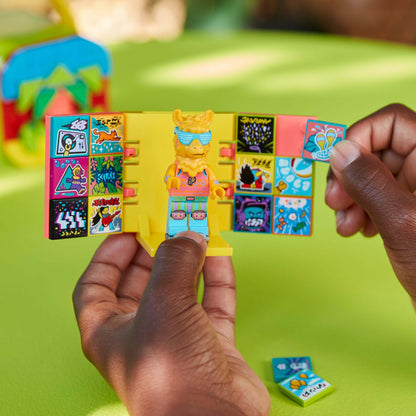 Child holding LEGO VIDIYO Party Llama BeatBox with colorful stickers, inspiring creativity in music videos.
