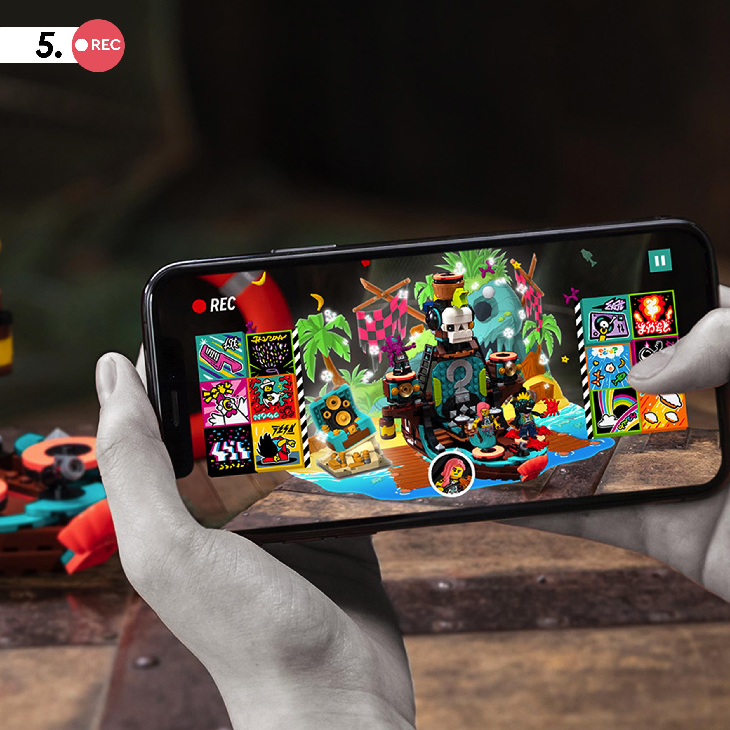 Child recording a music video using the LEGO® VIDIYO Punk Pirate Ship BeatBox set on a smartphone.