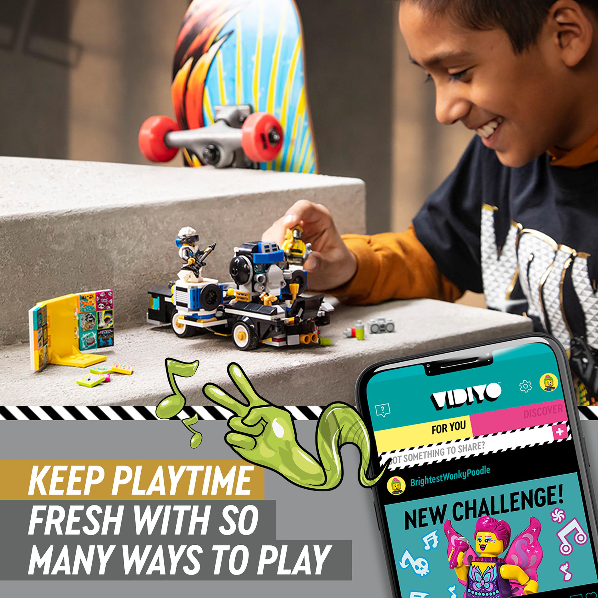 Child playing with LEGO VIDIYO Robo HipHop Car set and app, inspiring creativity in music video production.
