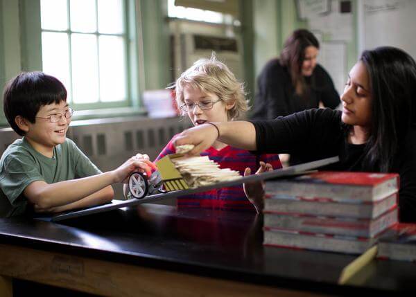 Children engaging with hands-on engineering project using littleBits STEAM Student Set in a classroom setting.
