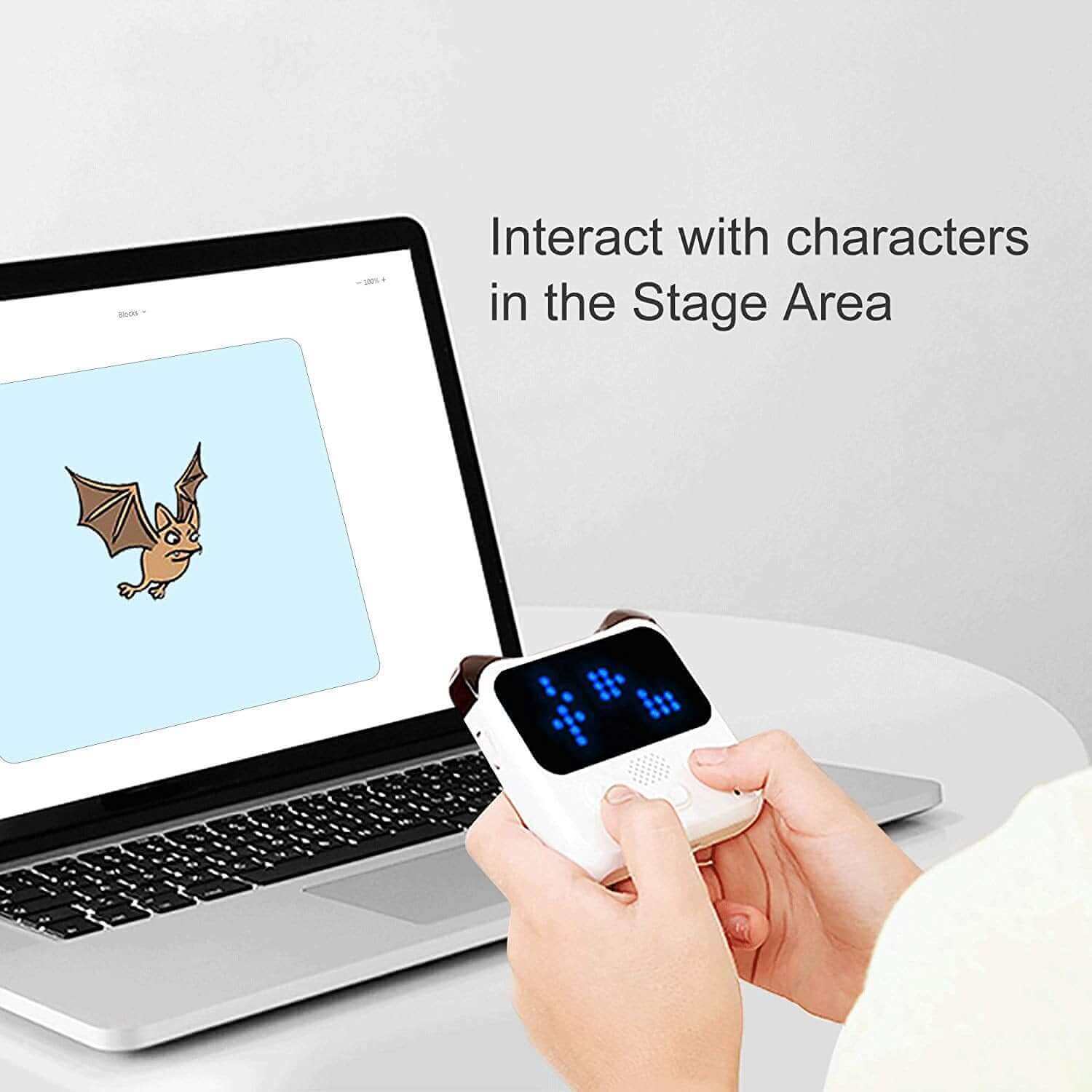Makeblock Codey Rocky (Education Version) user interacting with characters on screen using coding robot.