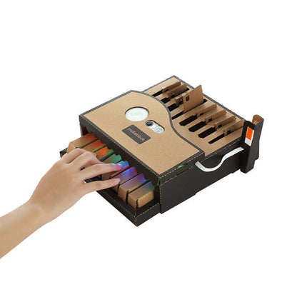 Hand reaching for colorful educational modules in the Makeblock Neuron Explorer Kit, ideal for STEM learning.
