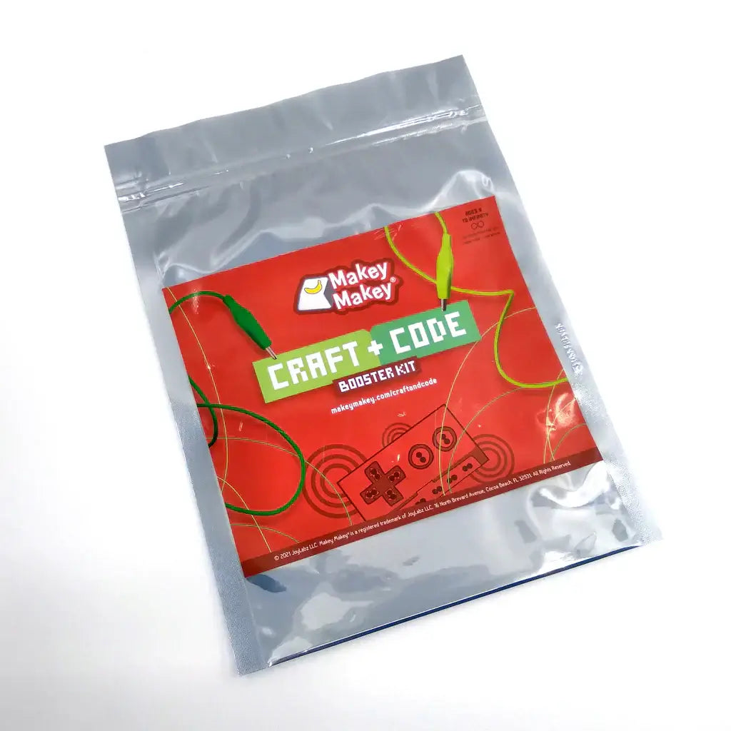 Makey Makey Craft + Code Booster Kit package featuring bright red design and connector cables.