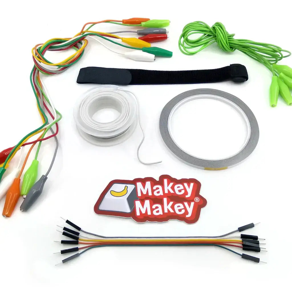 Makey Makey Get Up + Go! Booster Kit components including wires, tape, and clips for interactive projects.