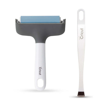 Cricut applicator and remover set featuring a brayer and broad-tip tweezers for fabric application and removal.