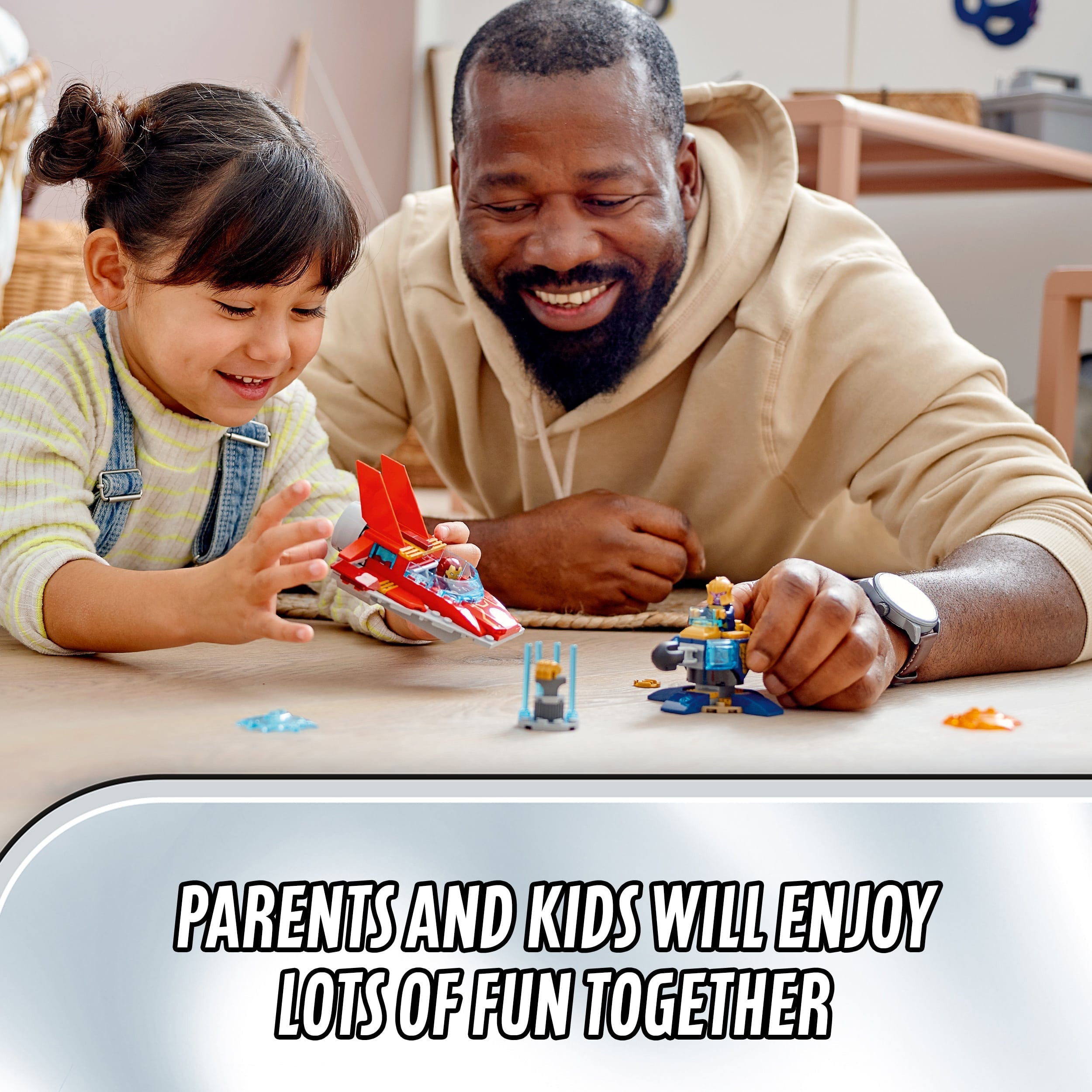 A father and daughter enjoying playtime together with LEGO® Marvel Avengers sets, highlighting family fun.