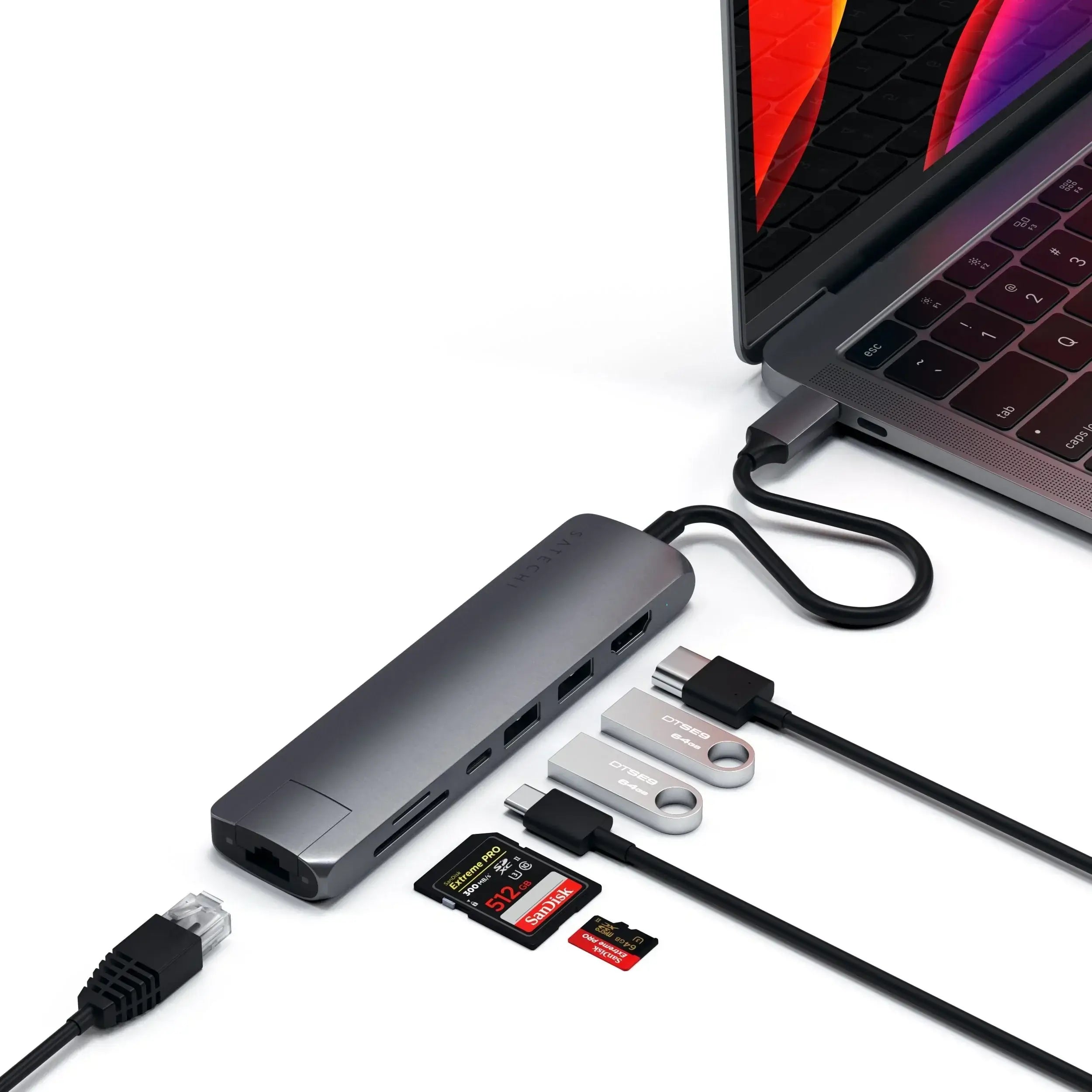 Satechi Type-C Slim Multiport Adapter connecting to MacBook Pro with Ethernet, HDMI, and USB ports.