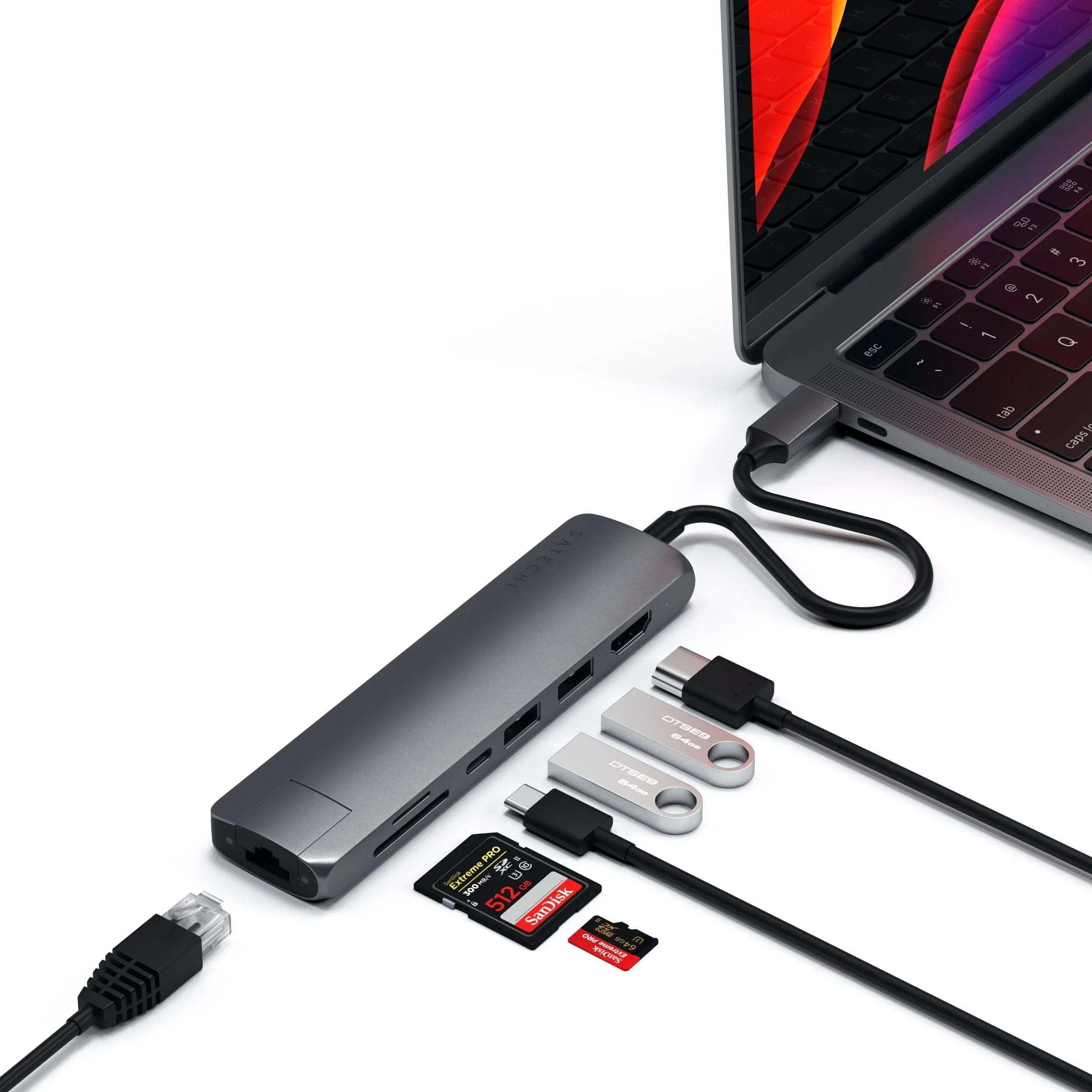Satechi Type-C Slim Multiport Adapter connecting to MacBook Pro with Ethernet, HDMI, and USB ports.