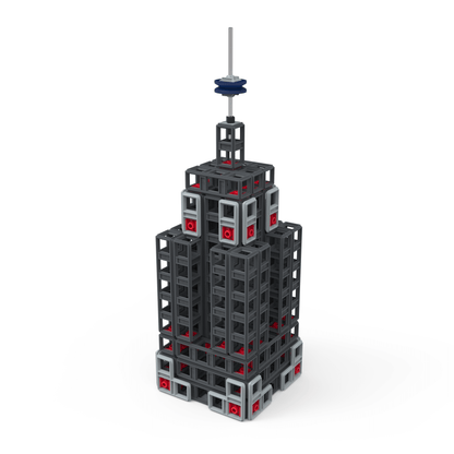 Miniature model of a skyscraper built from mechanical building parts in gray and red colors.