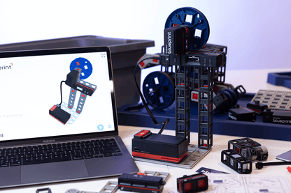 Sphero Blueprint Engineering Kit displayed with components and laptop, showcasing design and robotics activities.