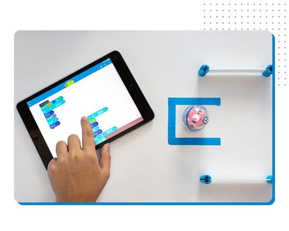 Hand coding the Sphero Mini with a tablet, showcasing interactive STEAM learning with robotic balls.