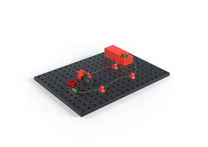 STEM Electronics kit showcasing a simple circuit with colorful components on a black base, promoting sustainable learning.